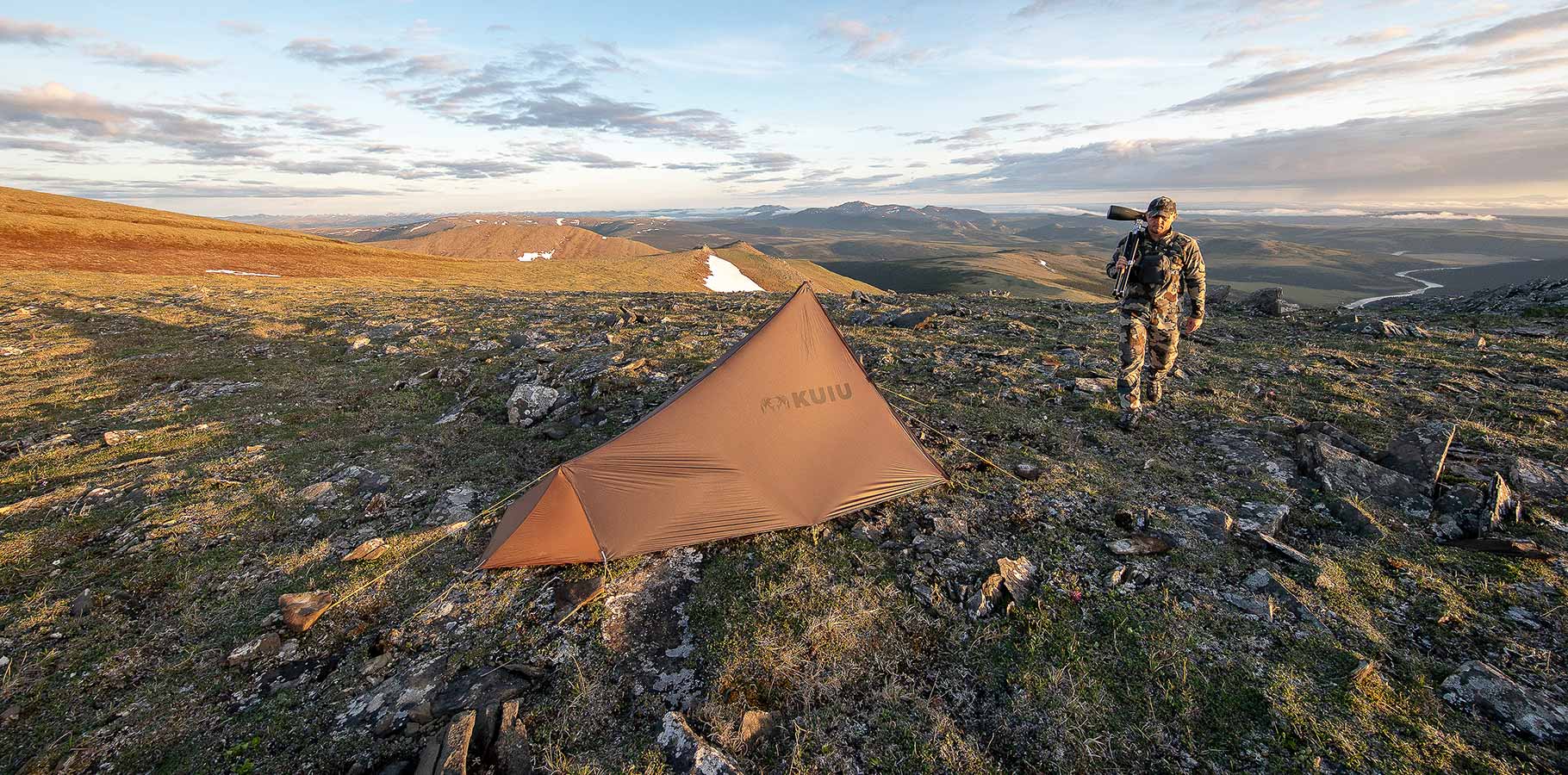 Brendan Burns walking back to pitched Summit Star 1 Person shelter after glassing for sheep