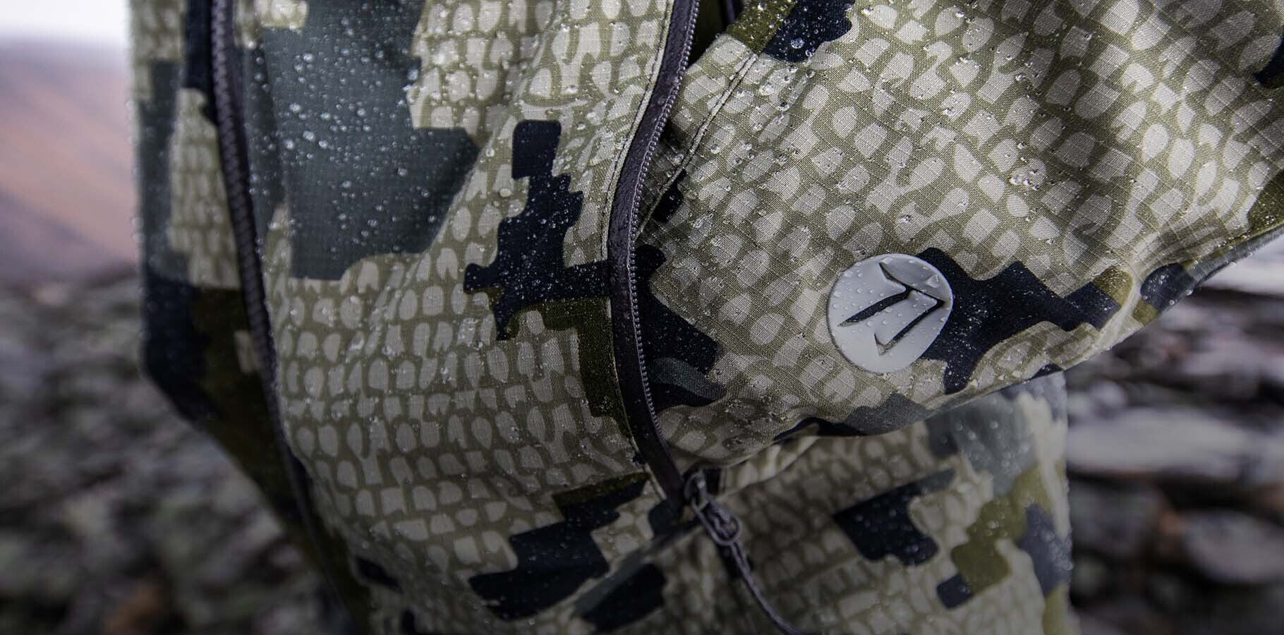 Detailed View of Kutana Storm Shell Jacket in Verde Camouflage Highlighting Water Beading from K-DWR Treatment