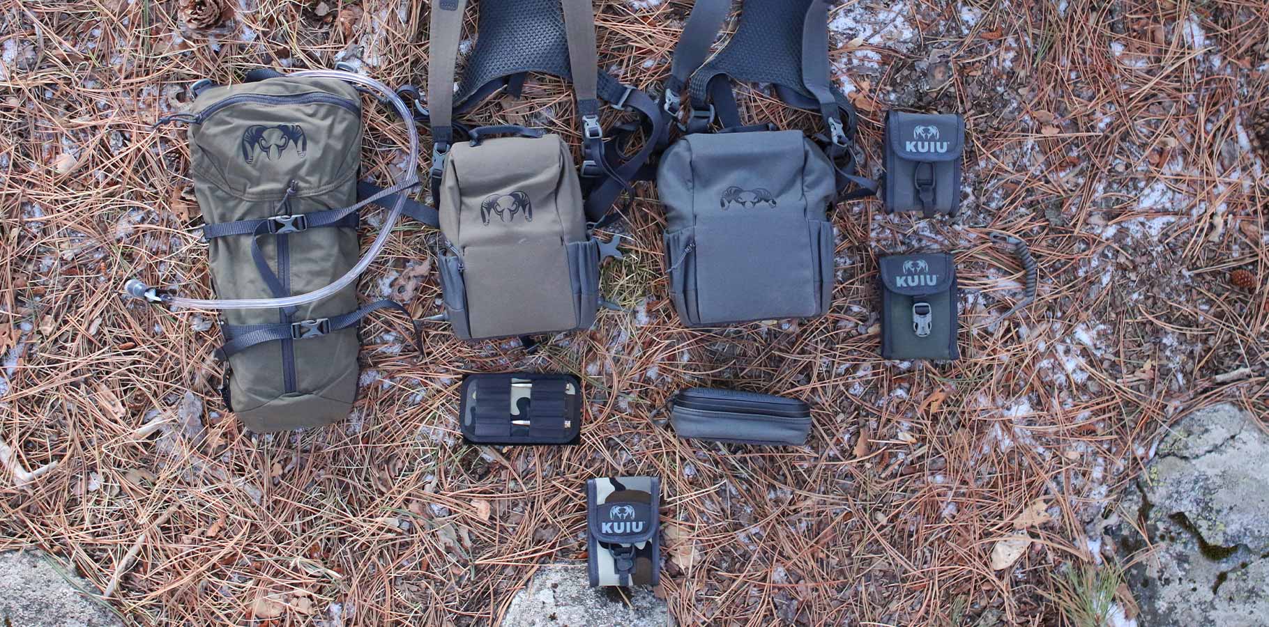 Modular hunting binocular harness on a bed of pine needles.