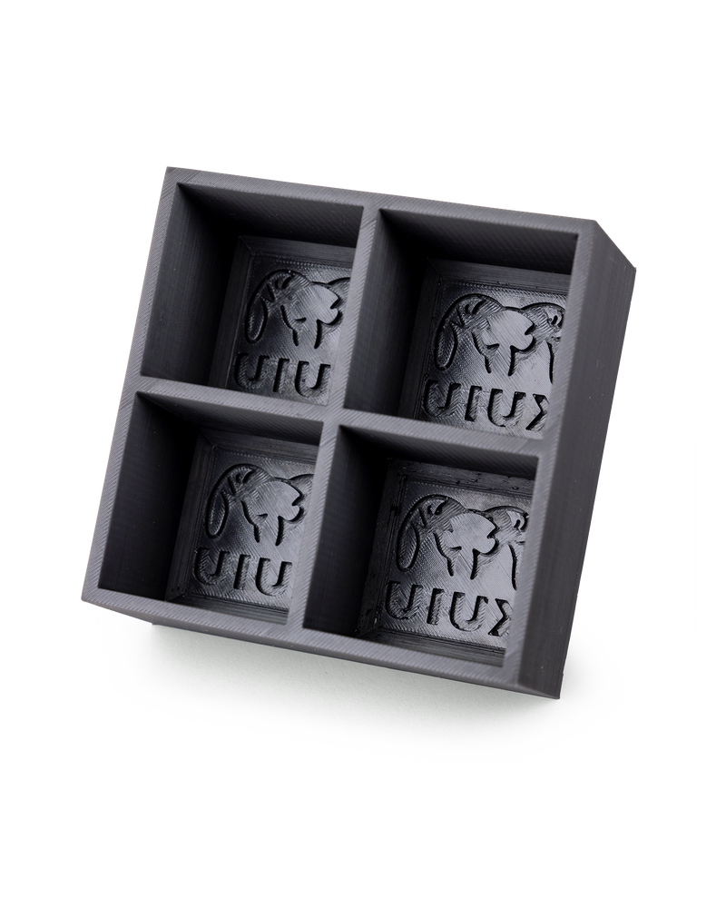 Interior view of KUIU Ice Cube Tray in Black with a KUIU logo and ram mold