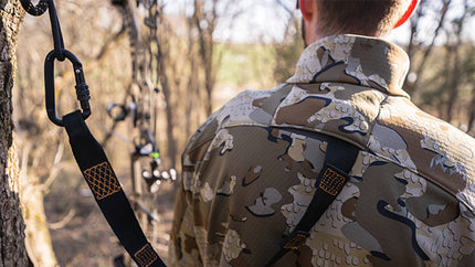 Back of Hunter in Treestand Wearing Encounter Jacket in Valo Camouflage Highlighting Layered Safety Harness Port